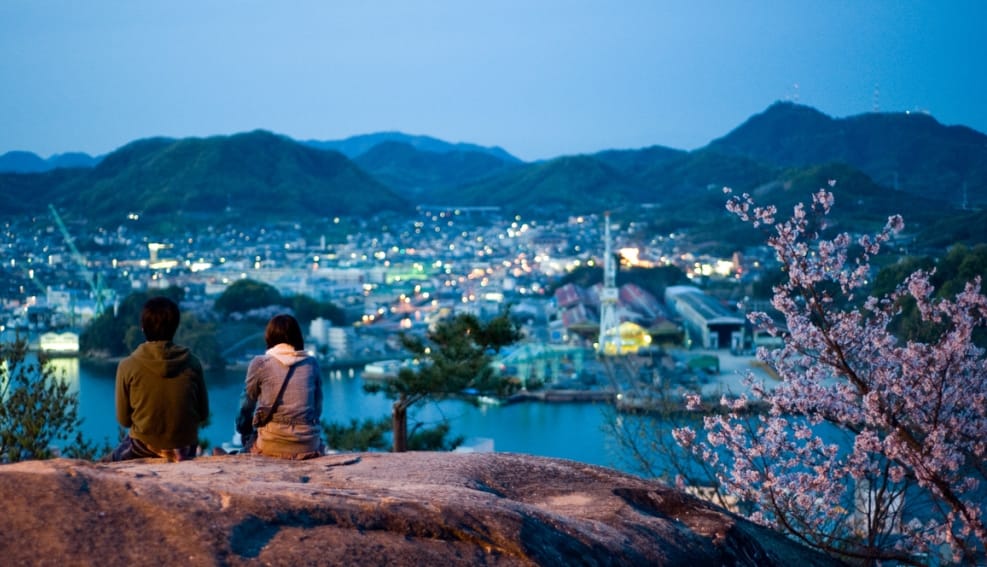 couple sitting on hill